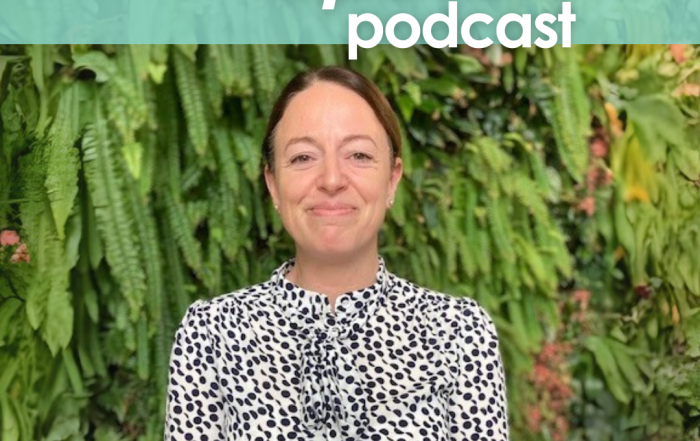 The cover for Episode 4 of The InDependent Spouse with Camilla Howard. Camilla is stood in front of a wood, smiling away and wearing a particularly fetching spotty dress.