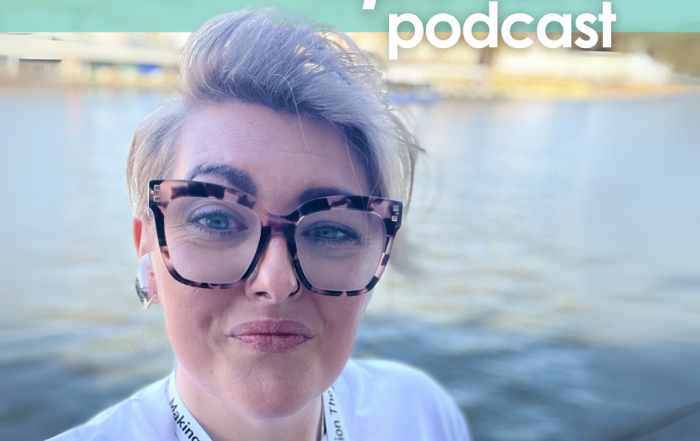 The cover of Episode 6 of The InDependent Spouse with Ria Jackson, who's stood next to the River Thames, with some funky glasses, and a white tshirt, looking ready to take on the world.